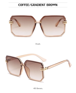 Detail of gradient brown oversized square sunglasses with elegant gold metal accents