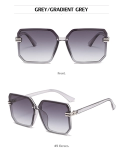 Detail view of square sunglasses featuring gradient grey lenses and striped metal accents