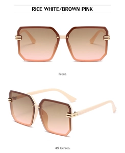 Detail of cream frame sunglasses with pink gradient lenses and gold metal accents