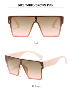 Detail view of rice white oversized flat top sunglasses with gold accents and gradient lenses
