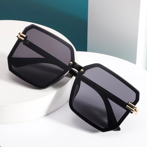 Chic oversized square rimless sunglasses with dark lenses and gold metal hinges for women