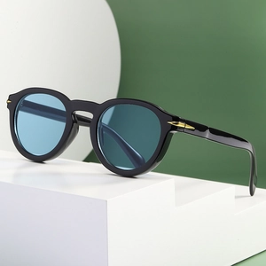 Retro round sunglasses with black frames and light blue lenses on a white display
