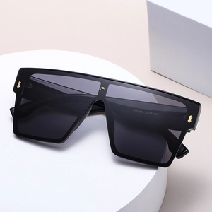 Fashion oversized flat top square sunglasses with black frame and gold rivets details