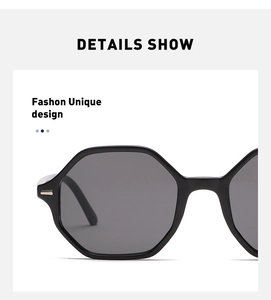Detail view of octagon sunglasses featuring polished black frame and silver metal accents