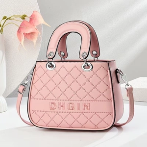 Pink quilted crossbody bag with diamond stitching and silver DHGIN branding detail