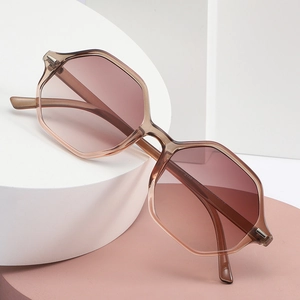 Fashionable geometric octagon oversized sunglasses with gradient lenses on display stand