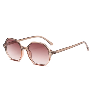 Octagonal translucent amber sunglasses with brown gradient lenses for a retro look