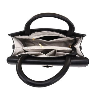 Interior detail of multi-layer tote bag showing organized pockets and gray lining