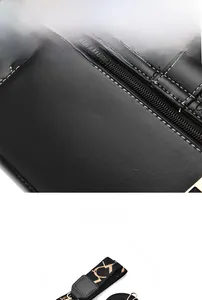 Close-up of black leather bag featuring white contrast stitching and embossed texture