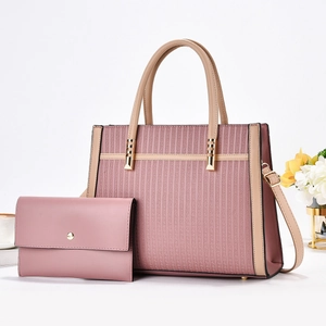 Elegant mauve tote and wallet set with geometric embossed patterns and gold hardware