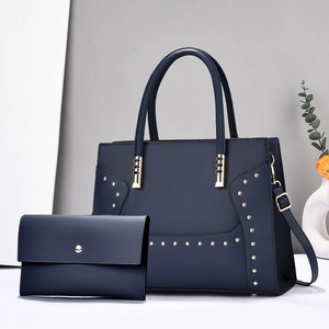 Navy blue striped handbag set with gold rivets including shoulder bag and envelope pouch