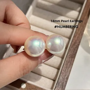 Macro shot of 14mm iridescent pearl clip-on earrings with mosquito coil backing