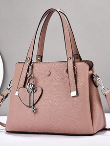 Litchi pattern pink tote bag with silver hardware and heart key charm accessories