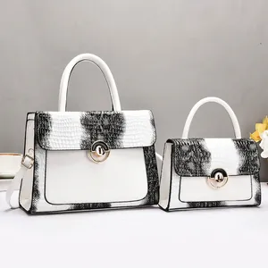 White faux crocodile skin tote bag set with golden hardware and adjustable straps