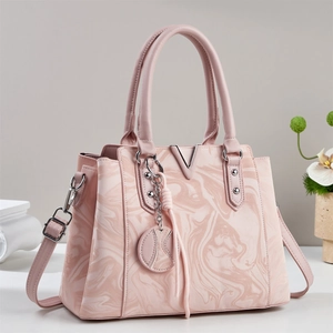 Elegant pink marble leather handbag for women with metallic V-shaped accent and strap