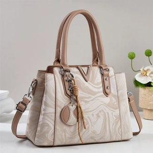 Elegant women's marble texture tote bag with silver V logo and adjustable strap