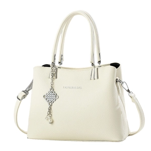 Off-white lychee texture tote bag with top handles and a metal Chinese knot charm