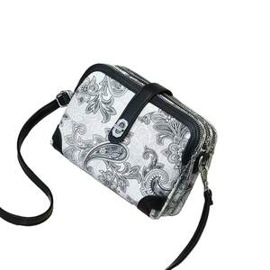 Three-layer faux leather crossbody bag with paisley print and metal buckle detail