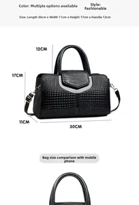 Detailed view of black crocodile pattern handbag with dimensions 30cm x 11cm x 17cm