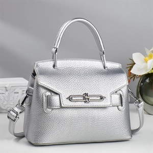 Luxury metallic silver litchi grain leather trapezoid handbag with a metal bar lock