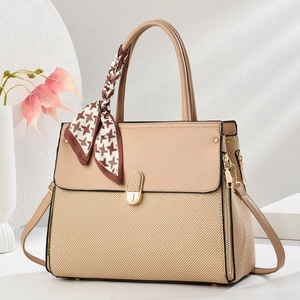 Elegant beige leather and woven tote bag with silk scarf and gold hardware accents
