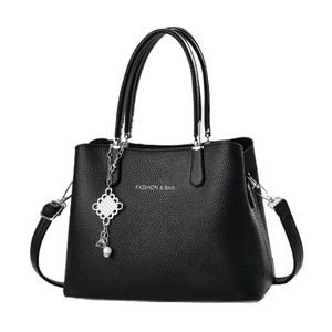 Black litchi grain shoulder bag with Fashion & Bag text and pearl metal charm pendant