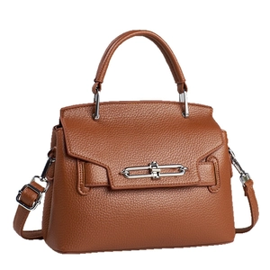 Brown lychee leather trapezoid shoulder bag with silver clasp and top handle