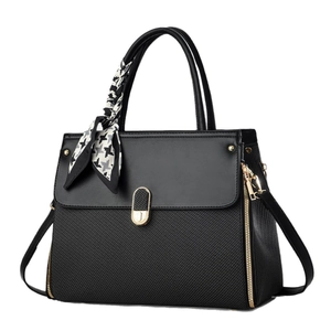 Elegant black woven tote bag with smooth leather flap and black-white silk scarf handle