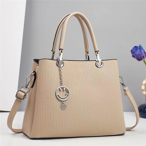 Beige striped tote bag with top handles and smiley pendant for women's daily commute
