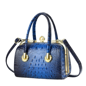 Blue crocodile embossed evening bag with diamond clasp and pearl handle accents