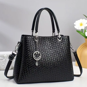 Chic black woven texture tote bag with smiley face pendant and detachable strap