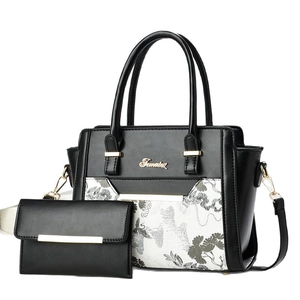 Famatex black leather handbag set with white floral print panel and gold metal logo