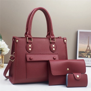 Three-piece burgundy litchi pattern tote bag set with matching pouch and card holder