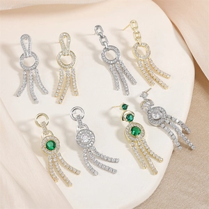 Elegant vintage tassel drop earrings with green emerald stones and zircon inlays