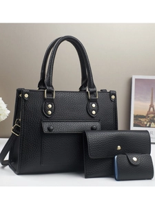 Three-piece black litchi pattern leather tote bag set with golden hardware and flower decor