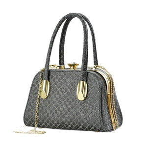 Deep grey diamond pattern evening bag with gold hardware and a detachable chain strap