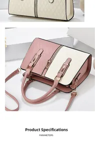 Detail of pink and white patchwork handbag with geometric quilting and metal zippers