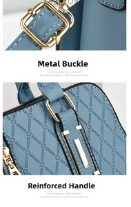 Detail of light blue handbag showing gold-tone hardware clasp and reinforced stitching