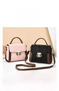Detail of pink and black tote bags with marble texture and leather shoulder straps