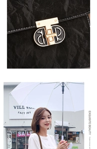 Detail of black pleated texture handbag with gold buckle and outdoor lifestyle view