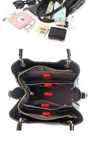 Detailed interior of wave pattern handbag showing large capacity and multi-pocket dividers