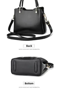 Detail view of the wave-textured black leather handbag showing the back and bottom panels