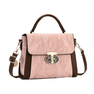 Minimalist pink and brown patchwork tote bag with gold buckle and crossbody strap