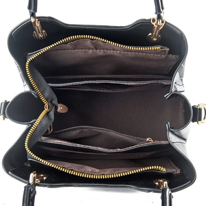 Black fashion handbag with wave pattern featuring organized multi-pocket interior storage