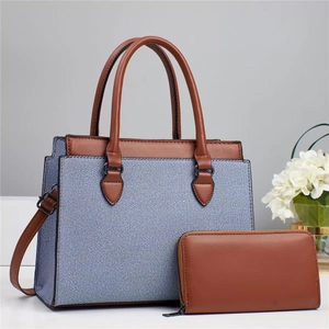 Blue and white striped tote bag and brown leather wallet set on light background