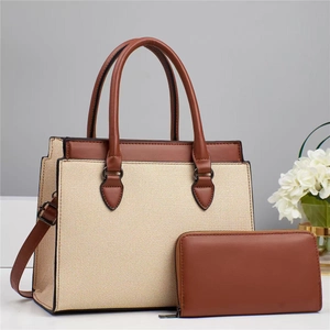 Detail of stylish two-piece set featuring beige woven texture bag and brown leather wallet