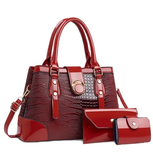 Three-piece red patent leather handbag set featuring crocodile pattern and large capacity