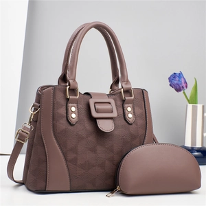 Detail of brown geometric quilted tote bag set with golden hardware and purple tulips