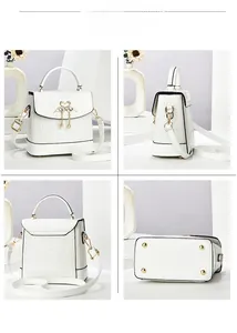 Vues détaillées du mini sac blanc motif crocodile avec breloque cygne et détails dorés