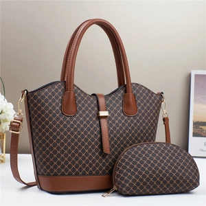 Elegant brown monogram tote bag set with matching small pouch and gold hardware accents